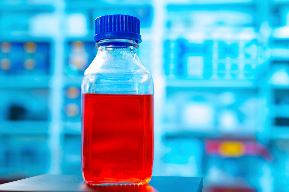 Red liquid in plastic bottle