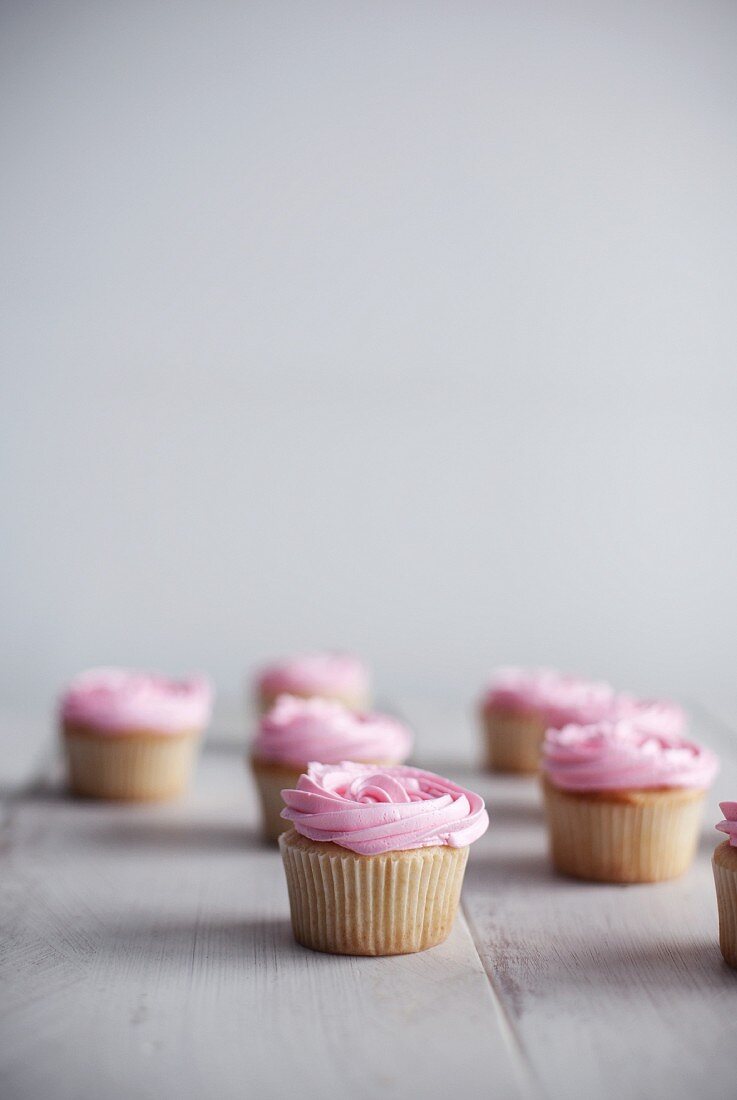 Cupcakes topped with pink frosting
