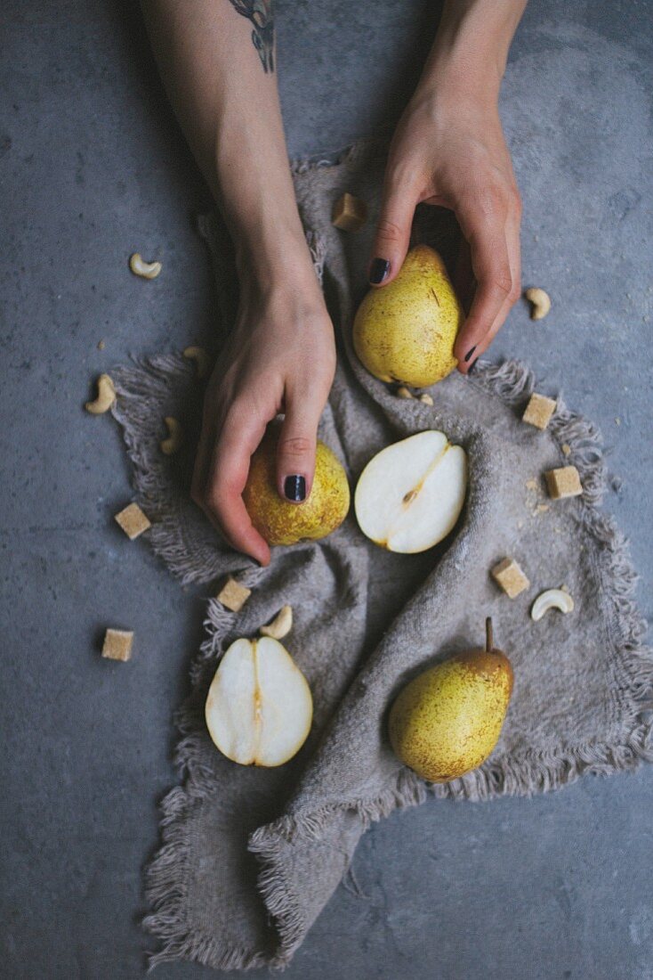 A woman taking pears