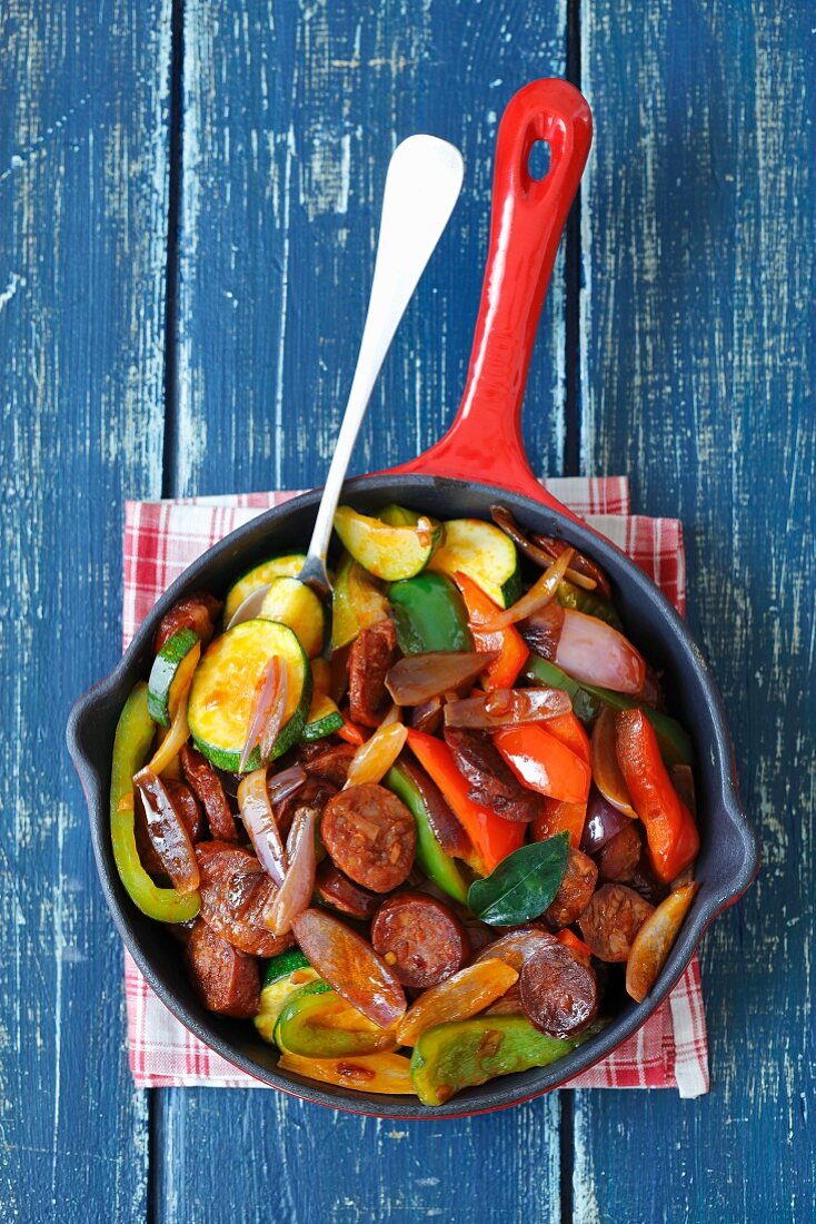 Fried chorizo with onions, peppers and courgettes