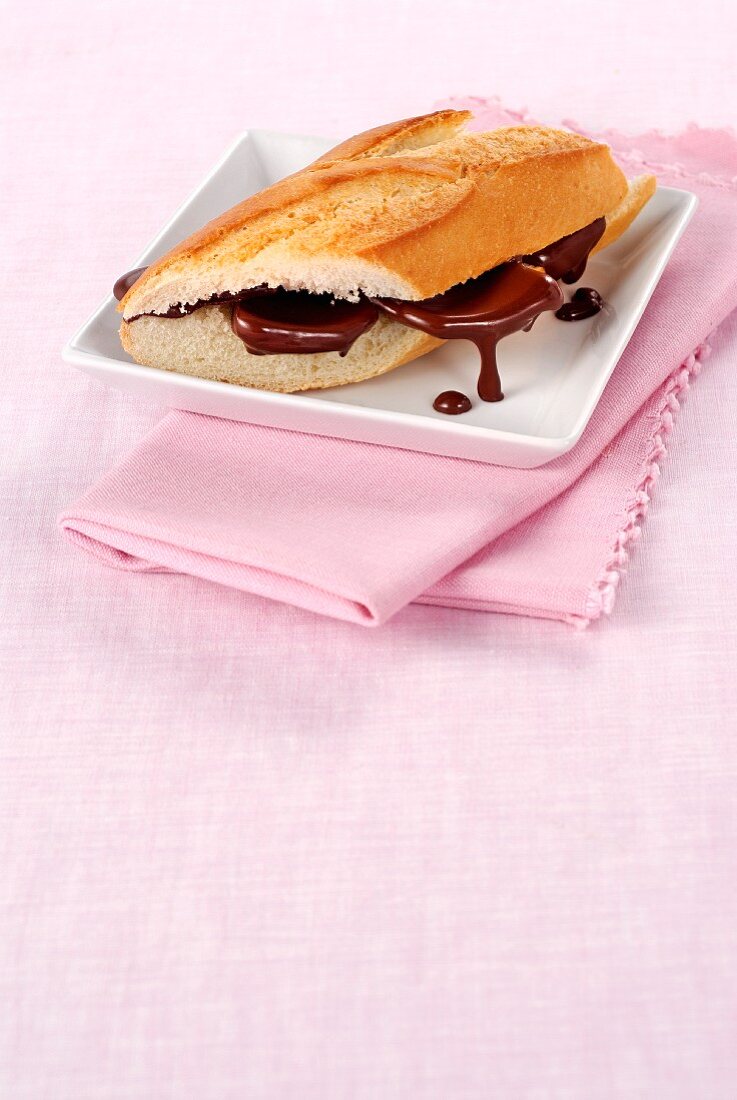 A baguette with chocolate sauce