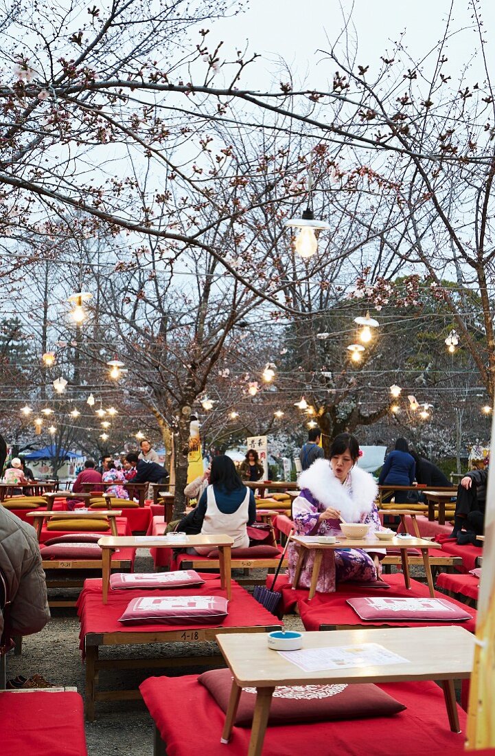 People seating outside at a restaurant (Asia)