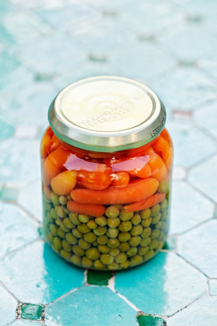 A jar of peas and carrots