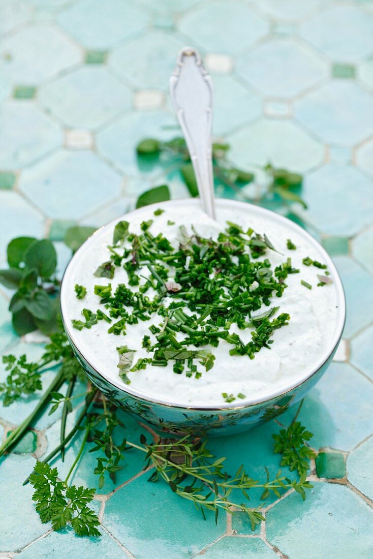 Herb quark in a bowl with a spoon