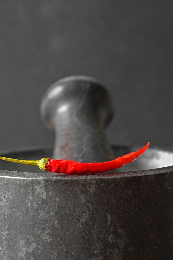 Red chilli pepper on a mortar