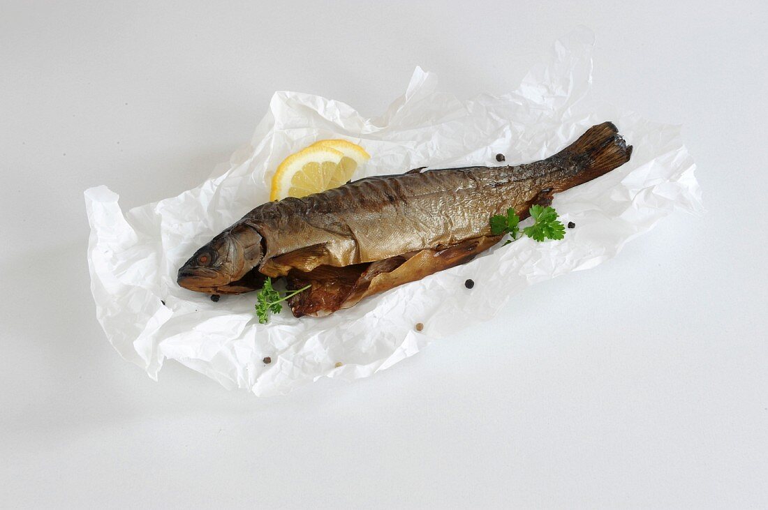 Smoked trout on a sheet of paper