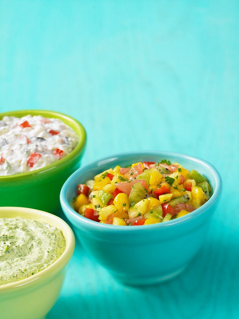 A dill sauce, a pepper sauce and exotic fruit salsa
