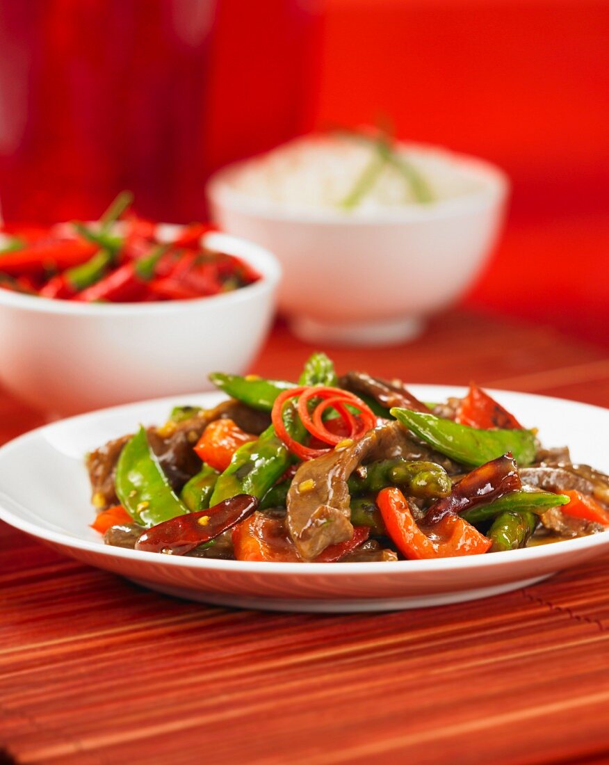 Szechuan beef with pepper and mange tout