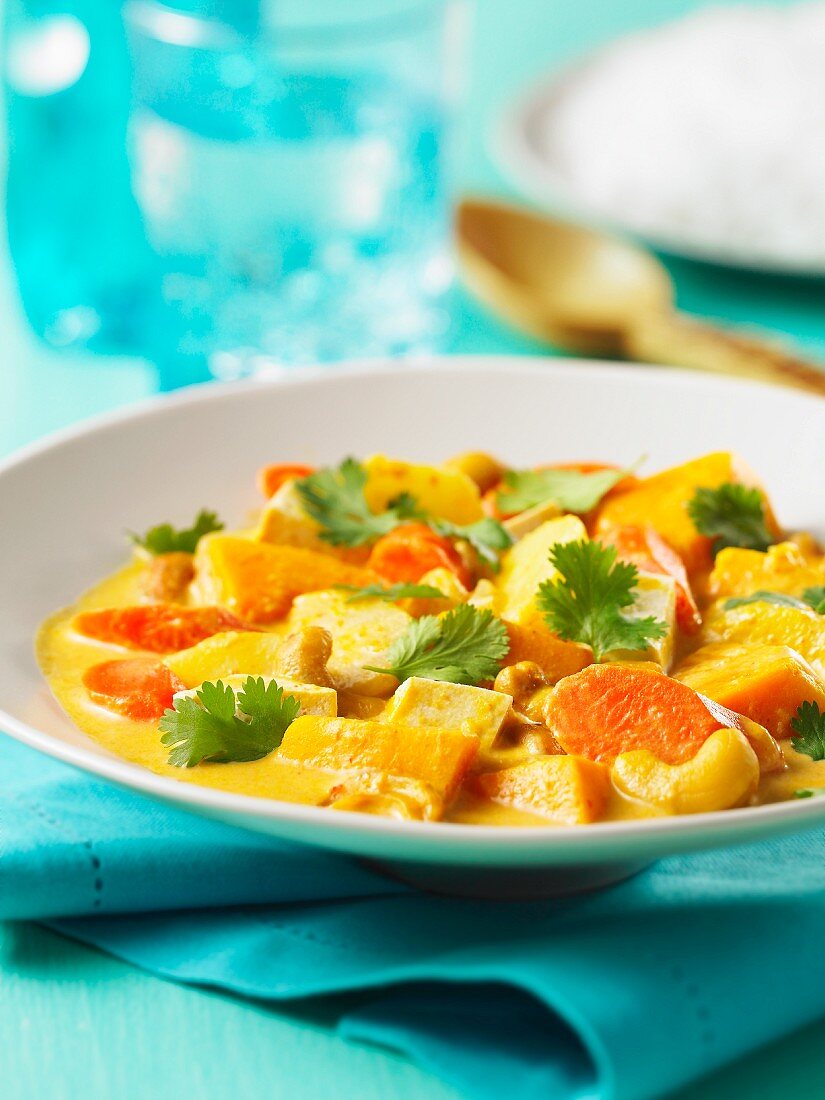 Winter vegetable stew with coconut and cashew nuts