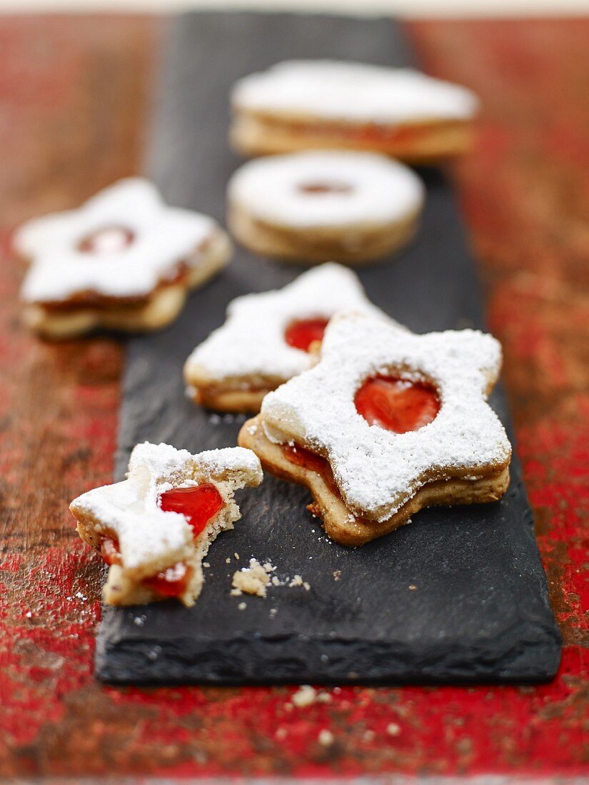 Jammy shortbread biscuits on a slate platter