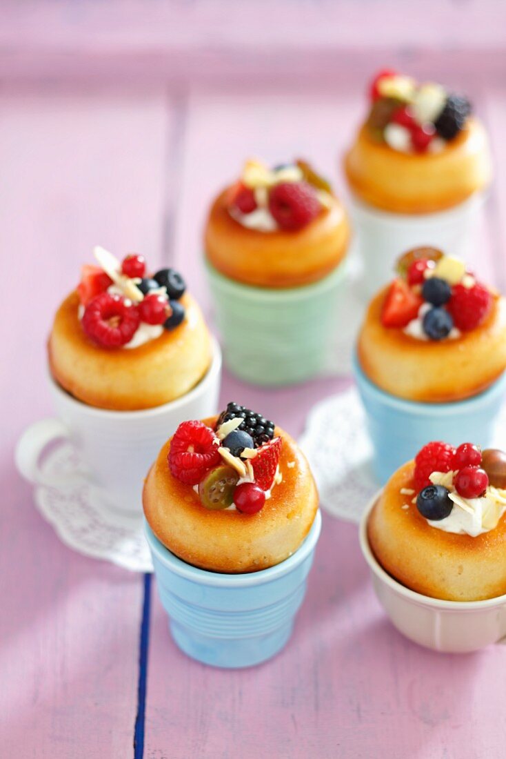 Baba au rum with whipped cream and berries