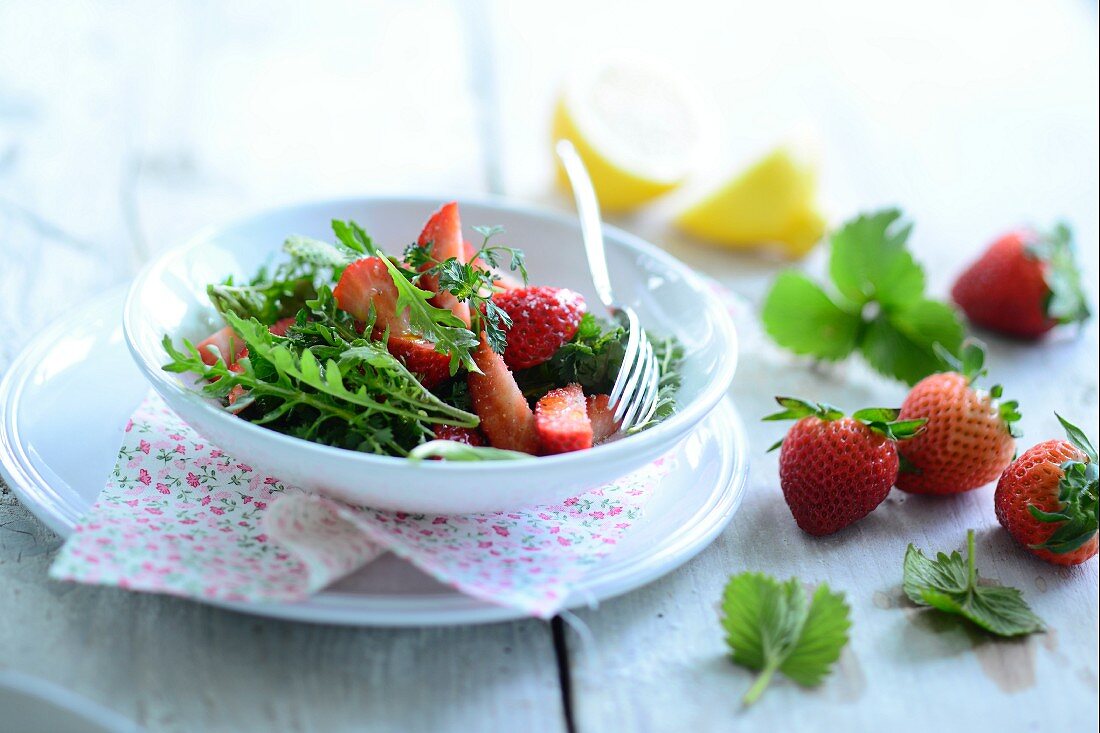 Herb salad with fresh strawberries