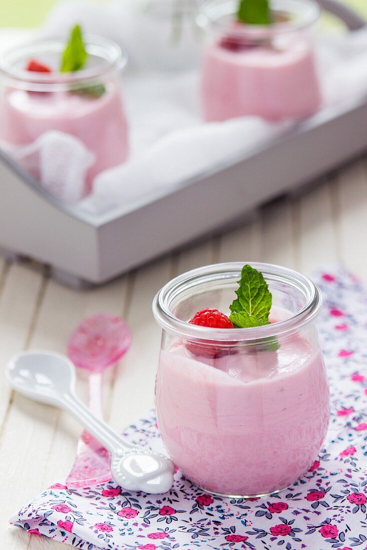 Raspberry mousse with mint leaves