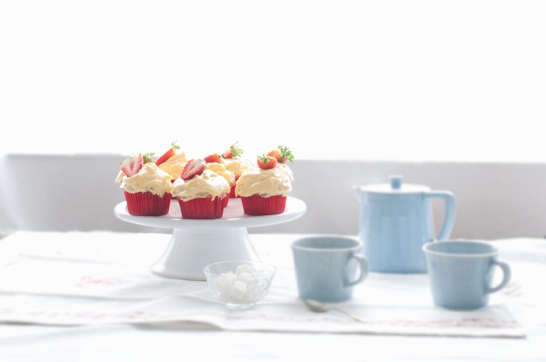 Strawberry pudding cupcakes on a cake stand