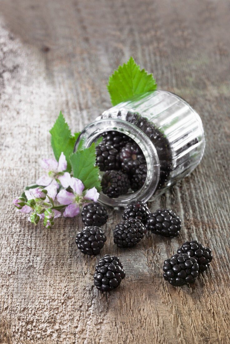 Blackberries in an overturned jar