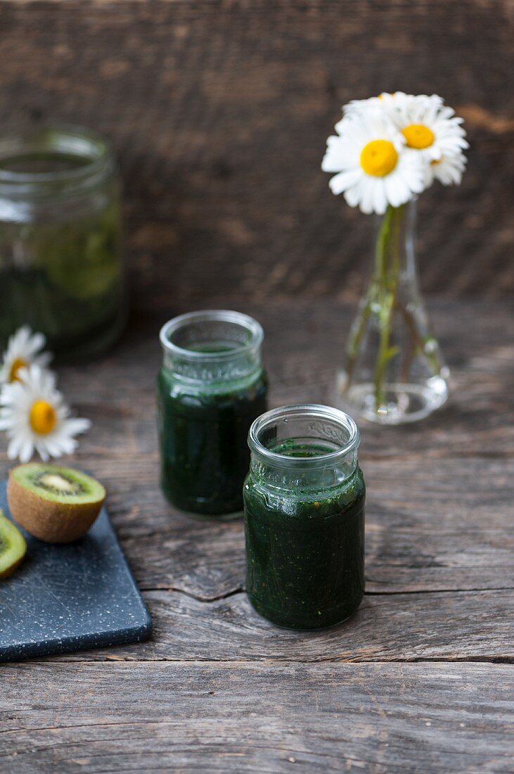 Green smoothies made with chlorella, spirulina, kiwi, lime and parsley