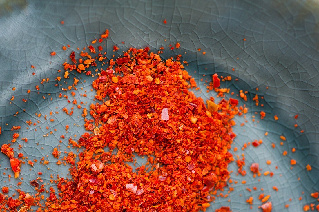 A plate of chilli flakes (close up)