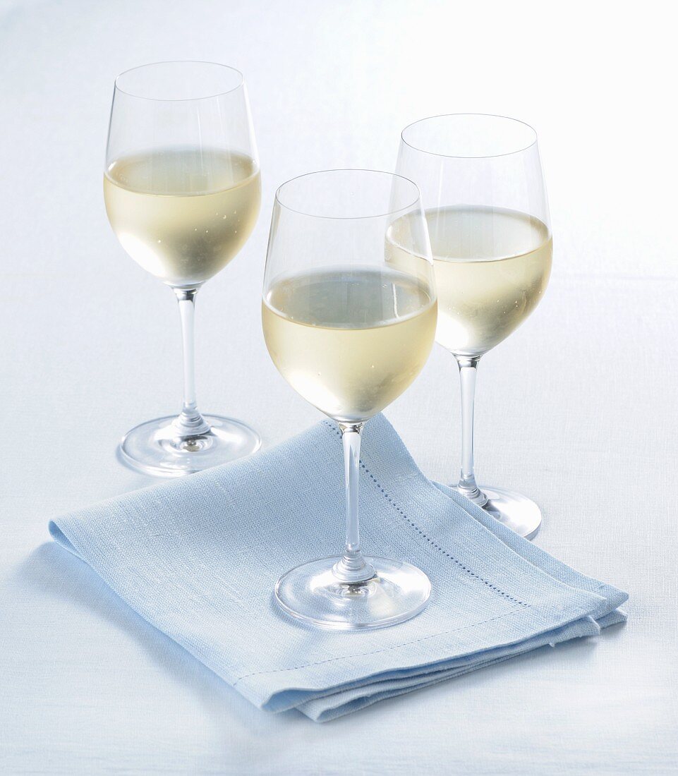 Glasses of white wine with condensation
