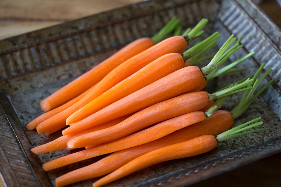 Peeled carrots on a tray