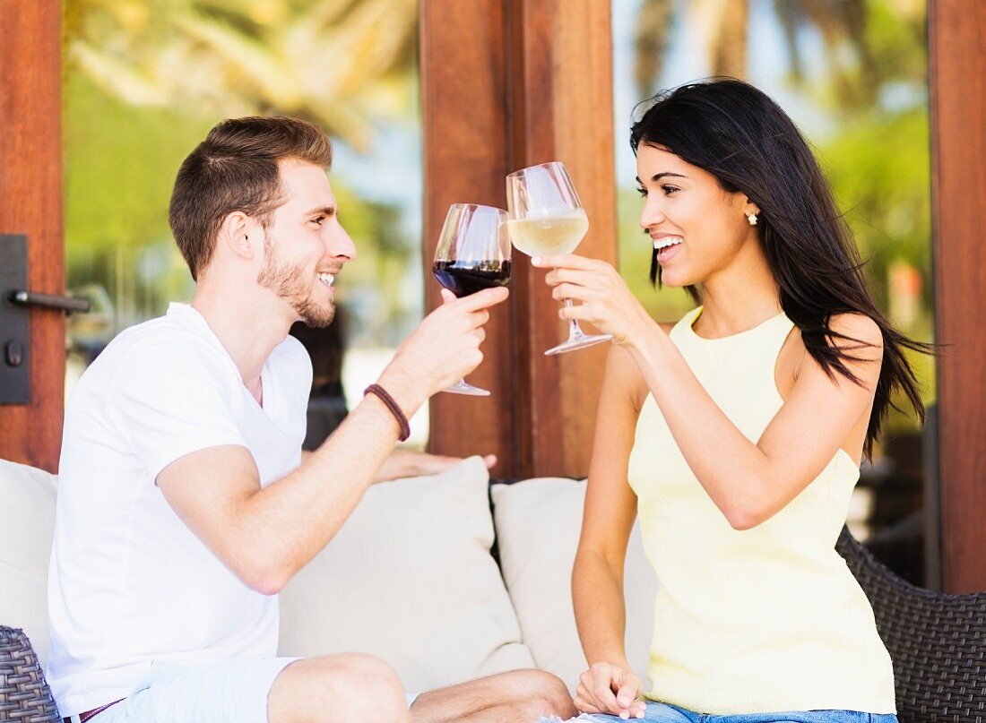 A couple drinking wine on a terrace