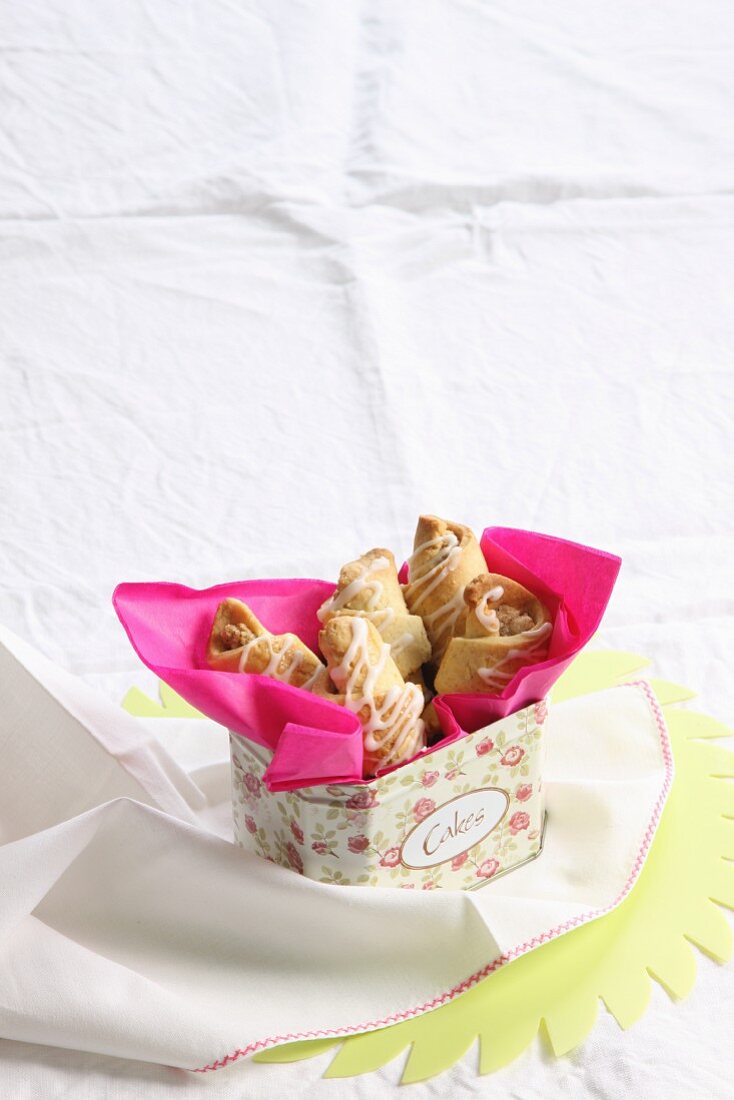 Nut pastries in a decorative metal tin