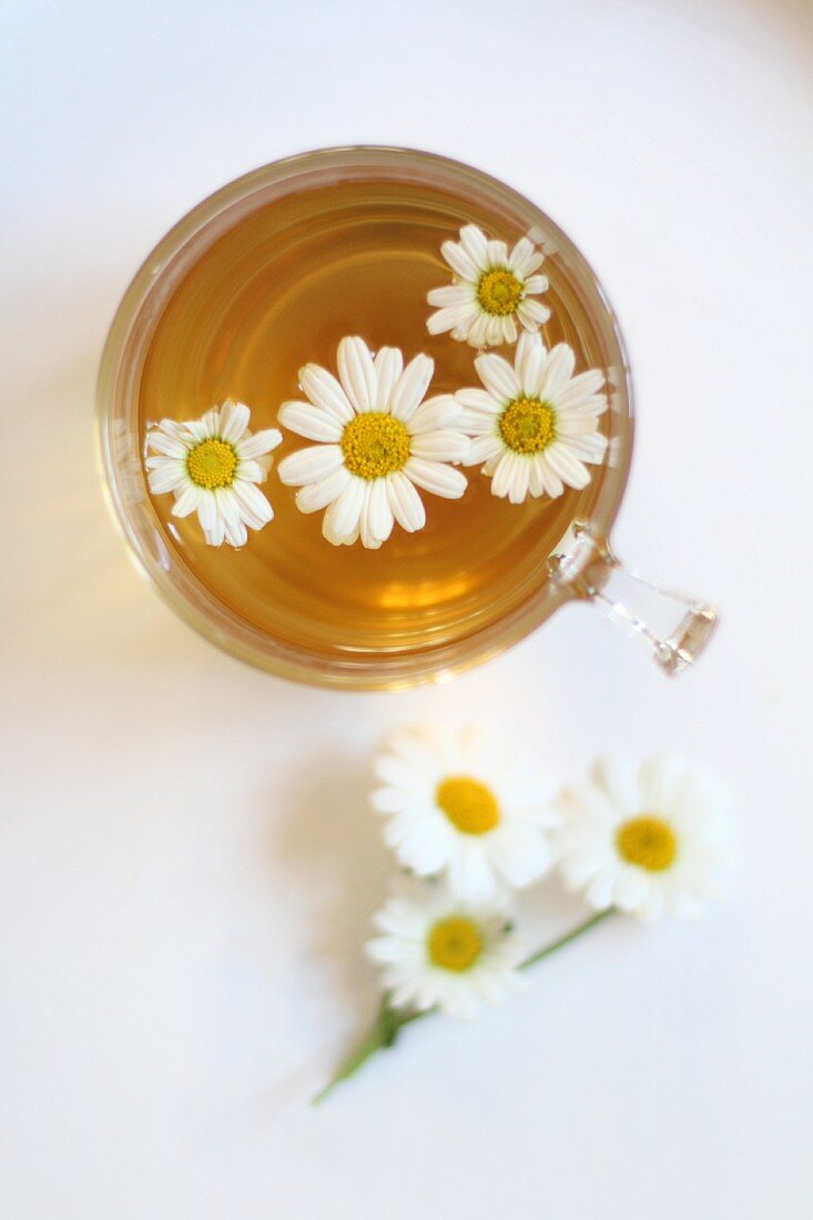 Camomile tea in a glass cup (seen from above)