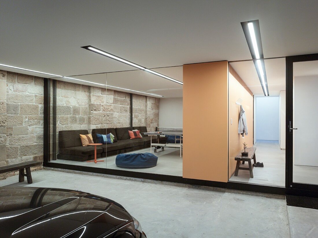 View from garage into living area through glass wall