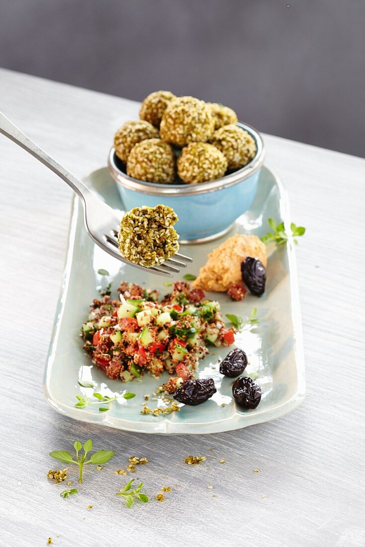 Falafel with cucumber salad and olives
