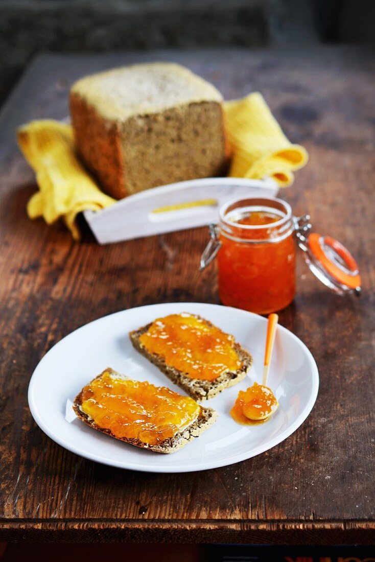 Two slices of wholemeal bread with apricot jam