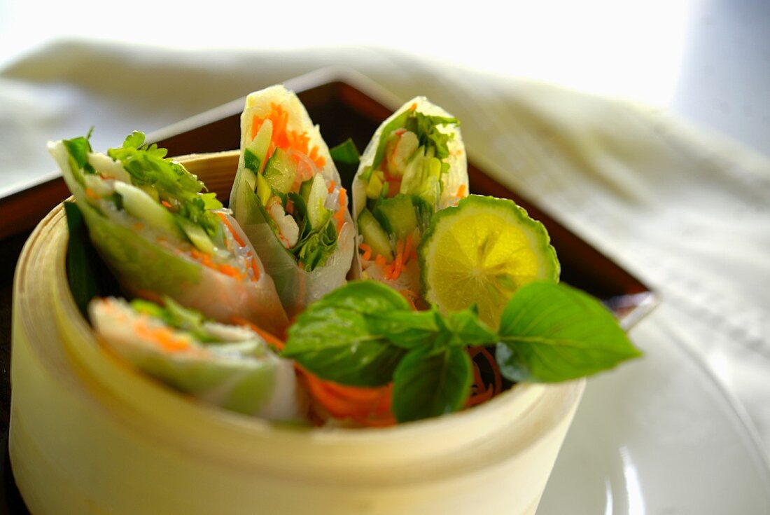 Stuffed rice paper rolls in a steamer basket (Cambodia)