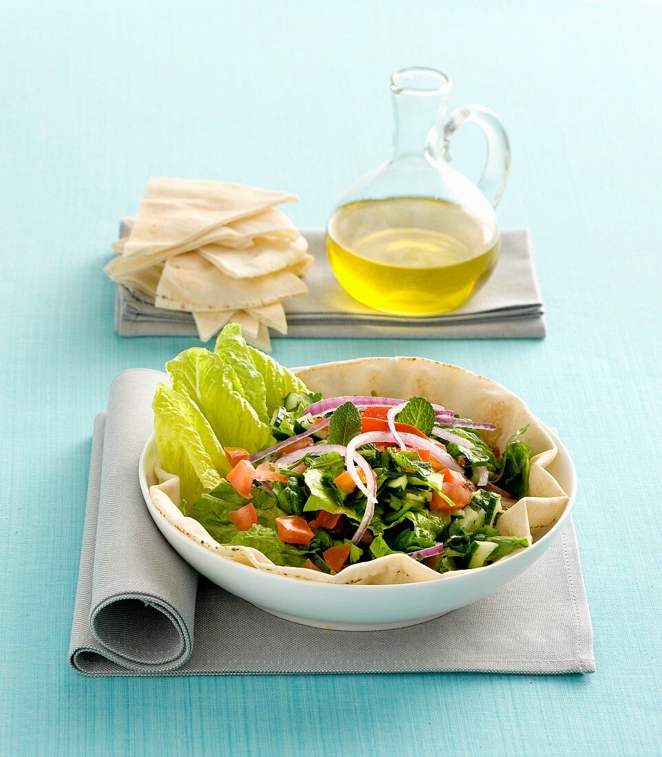 A mixed salad served on unleavened Arabian bread