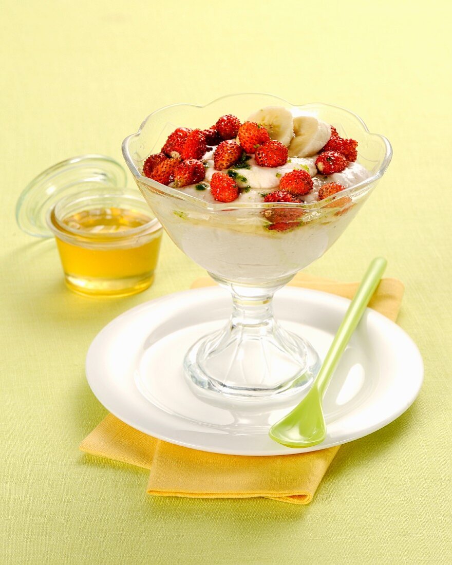Banana mousse with fresh wild strawberries