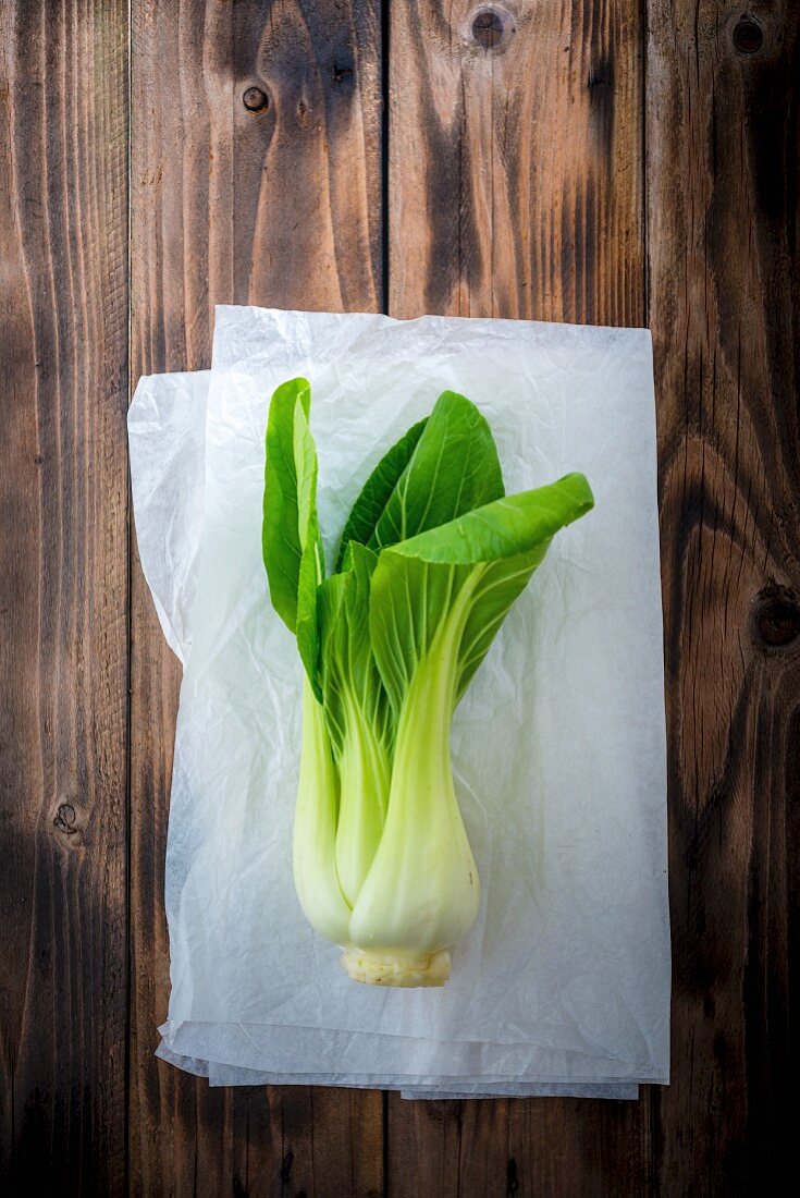 Bok choy on a piece of white paper