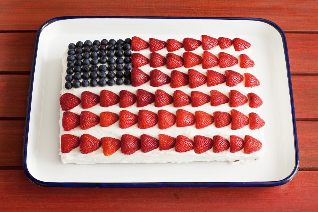 A strawberry and blueberry American flag cake for 4th July