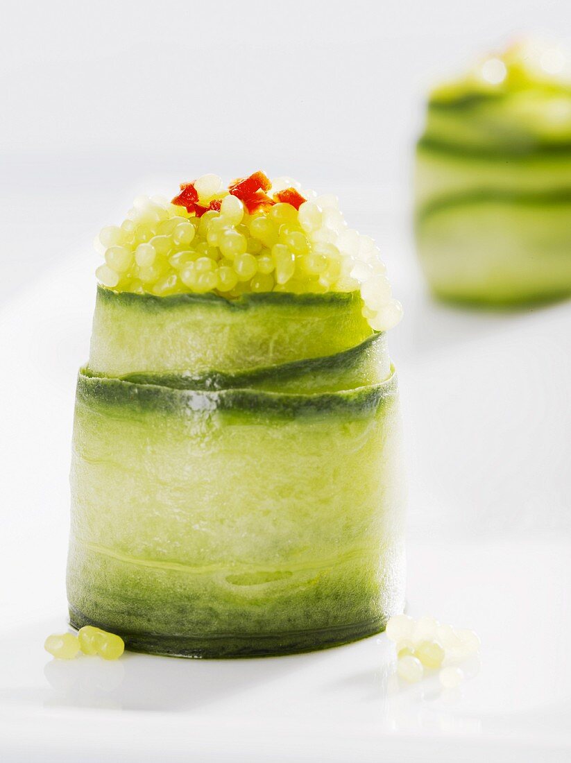 Courgette roles garnished with green vegetarian seaweed caviar