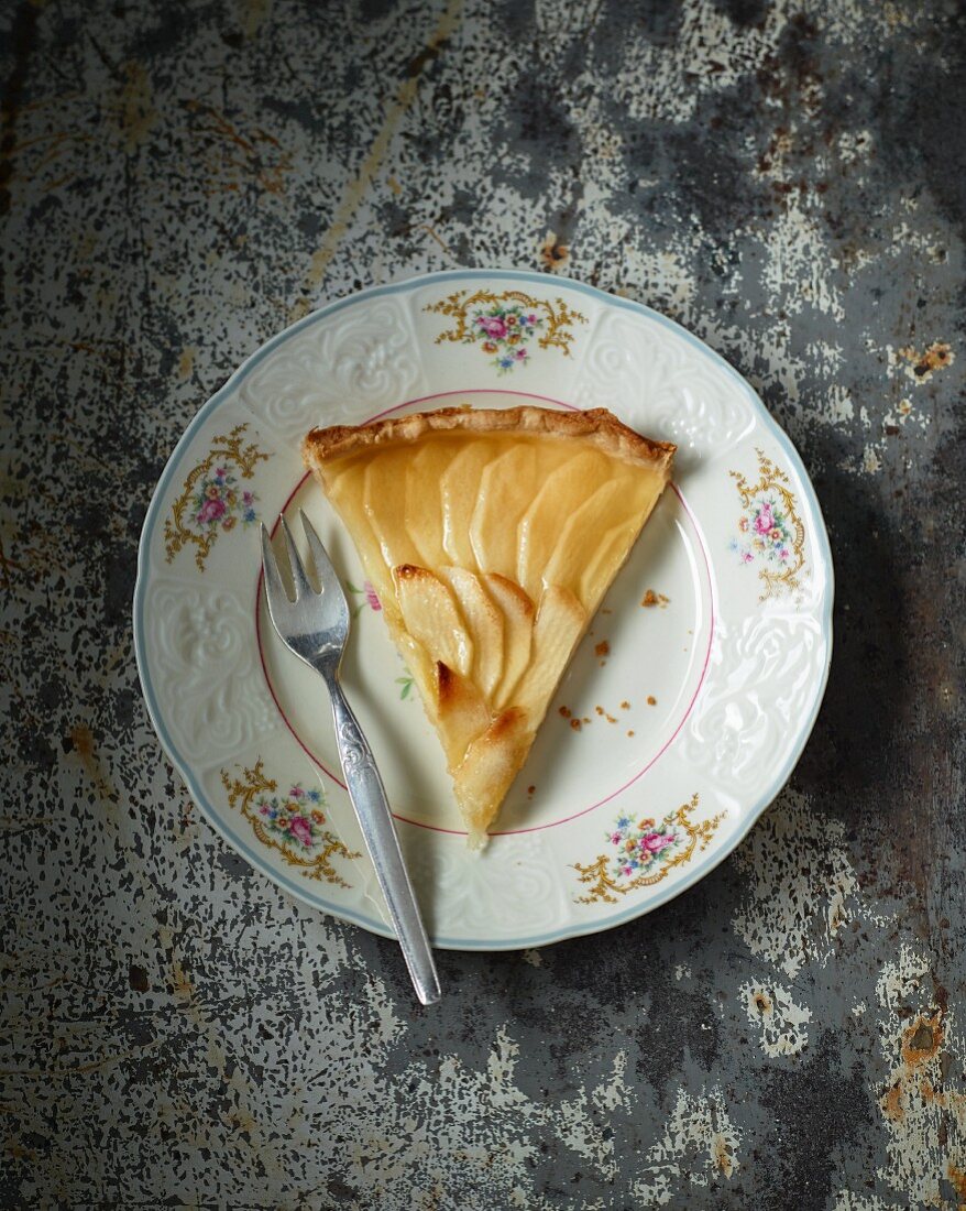 A slice of apple tart with apple jelly