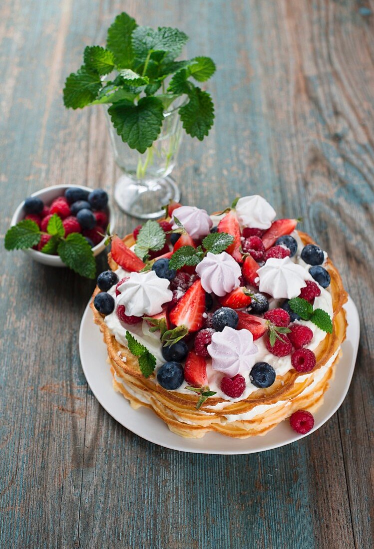 Waffle cake with berries and meringue
