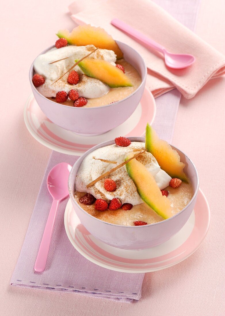 Melon sorbet with cream and strawberries