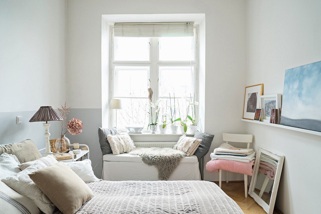 Cosy, feminine bedroom in shades of grey