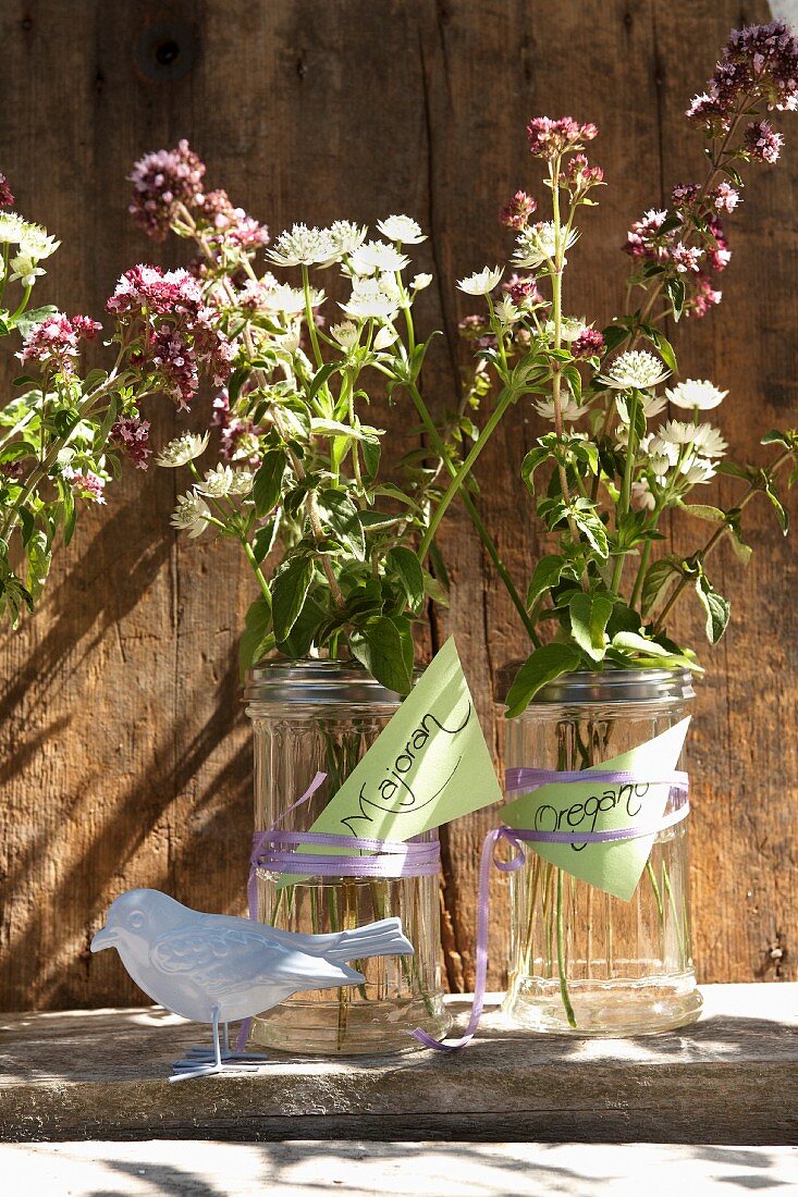 Marjoram flowers and astrantia in sugar shakers with labels