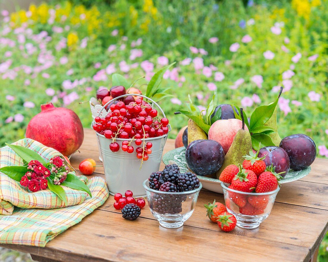 An arrangement of fruit on a garden table