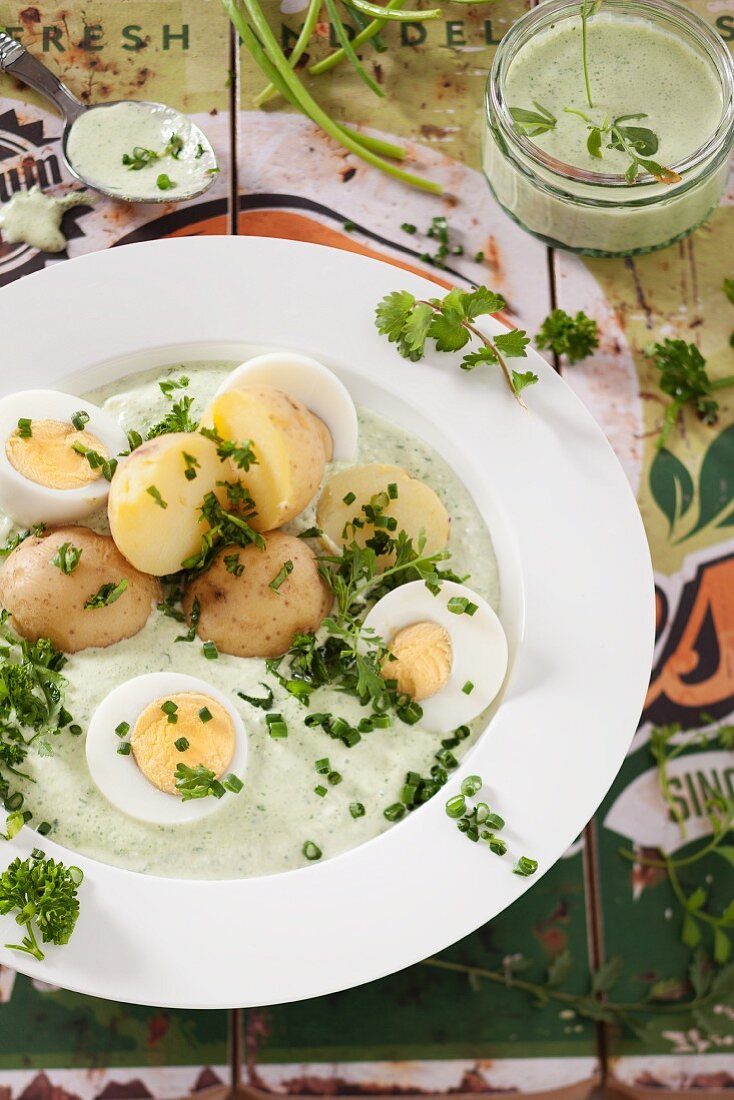 New potatoes with green sauce and hard-boiled eggs