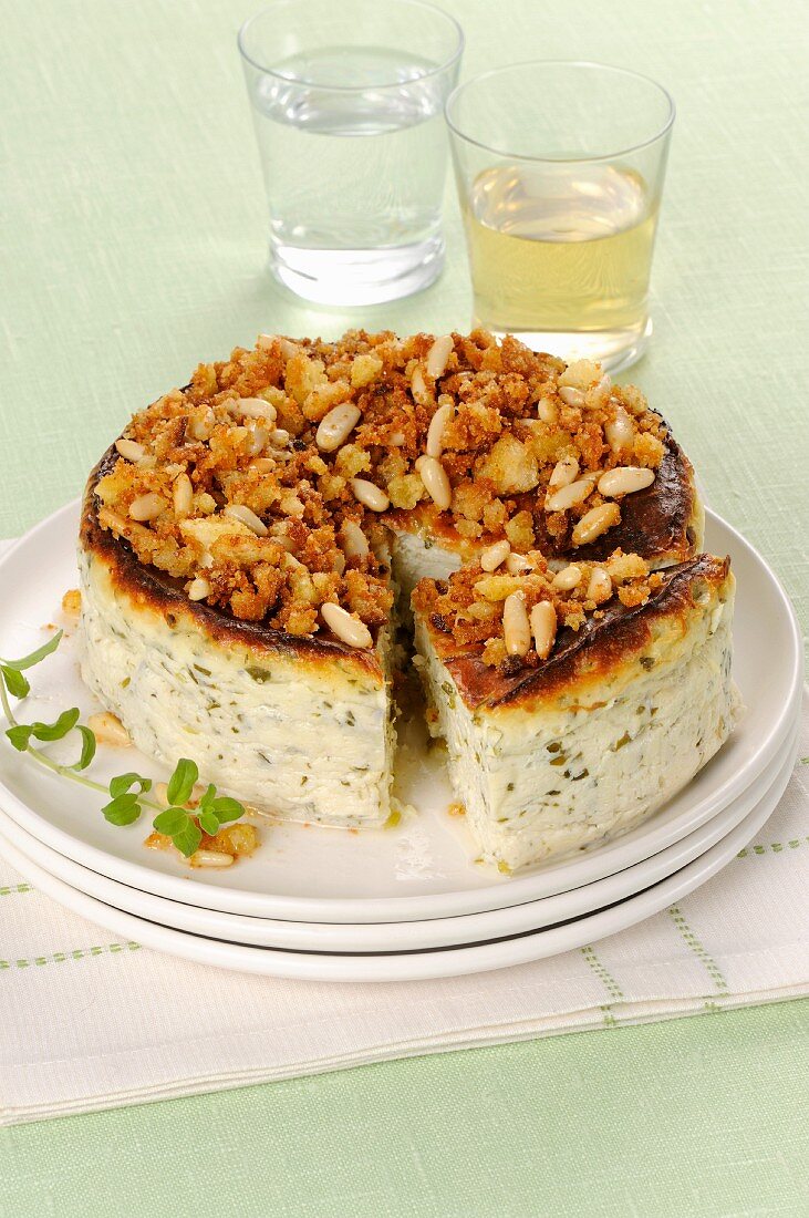 Ricotta and herb cake with a pine nut and bread crumble