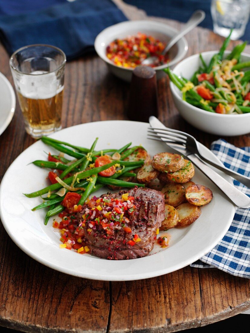 Beef steak with pepper salsa, green beans and fried potatoes