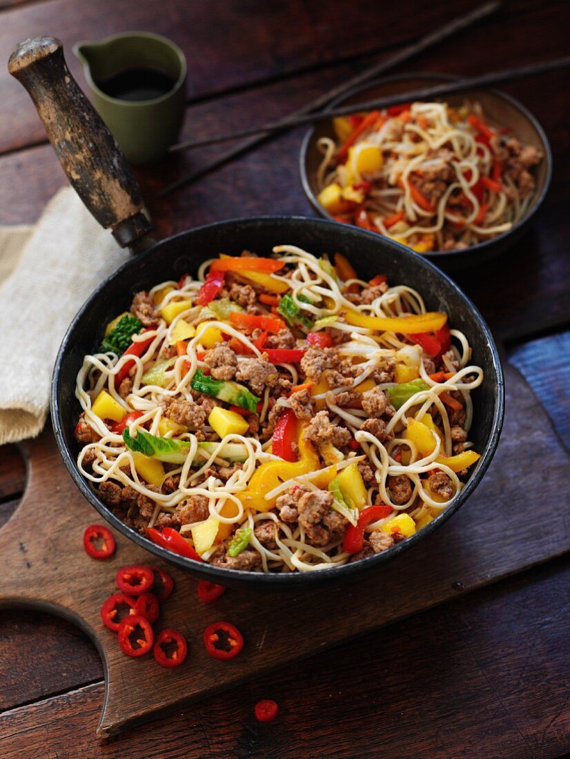 Fried egg noodles with pork, mango and chilies