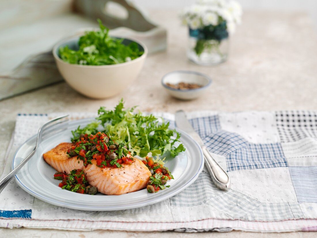 Salmon with a pepper and caper salsa and lettuce