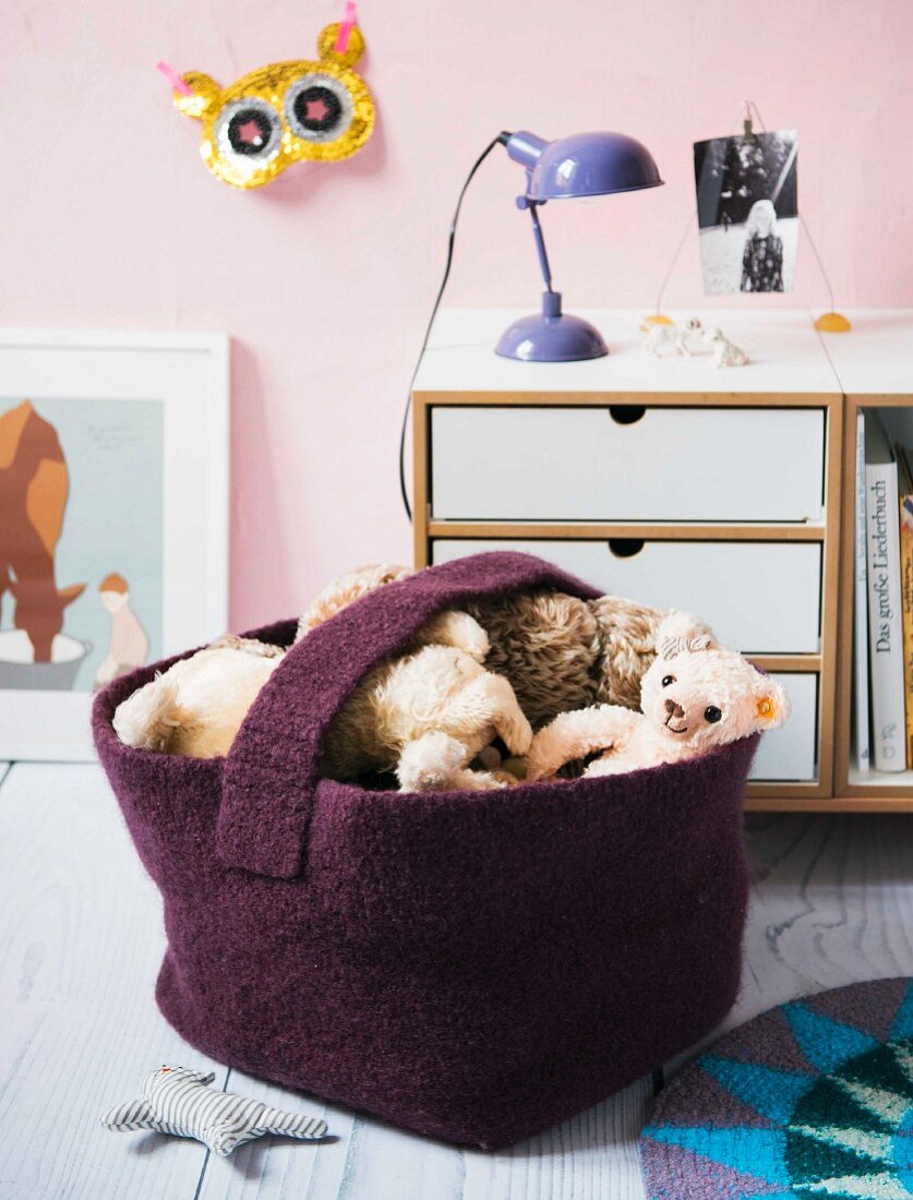 A homemade crocheted floor basket made from felting wool