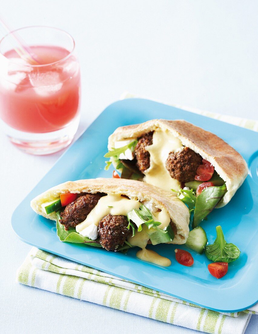 Stuffed into bread with meatballs and Greek salad