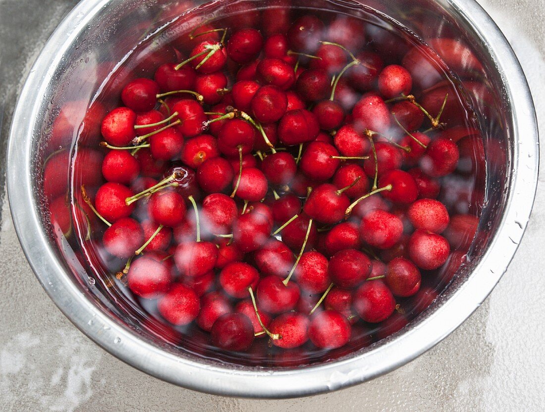 Cherries in a large bowl of water