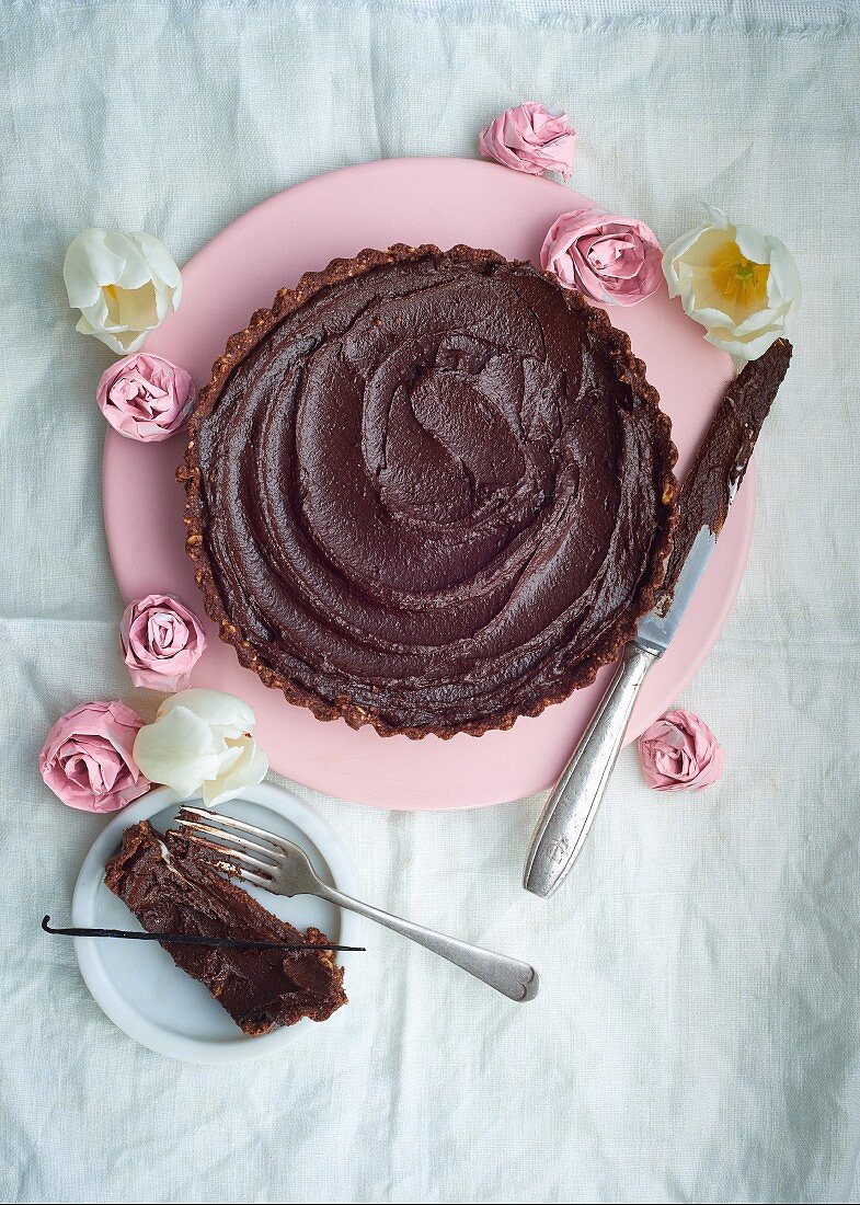 A rich chocolate and nuts tart with paper roses